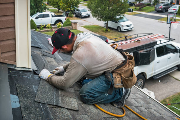 Professional Roofing technician working in Udell, IA